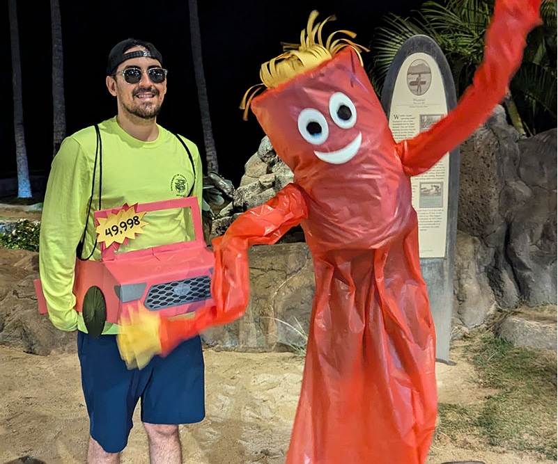 Paul dressed as a Toyota pickup truck and Jessie dressed as a whacky wavy inflatable tube person for Halloween