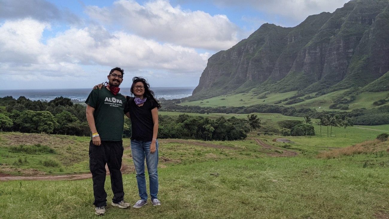 Paul and Jessie on a grass field at Kualoa Ranch